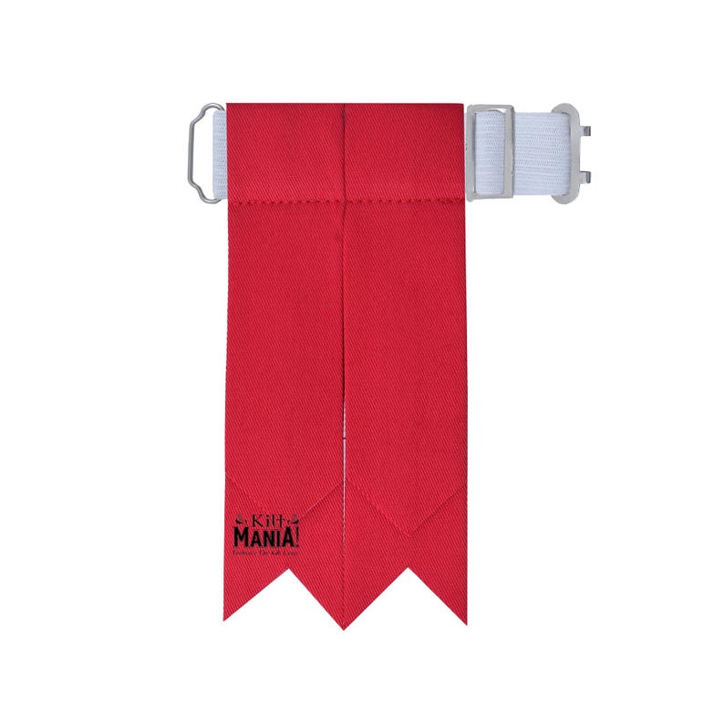 May include: Red kilt hose with a white strap and buckle. The hose has a pointed end and the text "Kilt Mania!" is printed on the bottom.