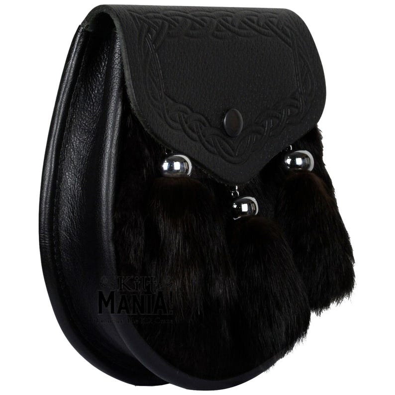 May include: Black leather sporran with a Celtic knot design and three black fur tassels.