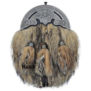 May include: A brown and black fur sporran with three tassels and a silver metal kilt pin featuring a thistle design.