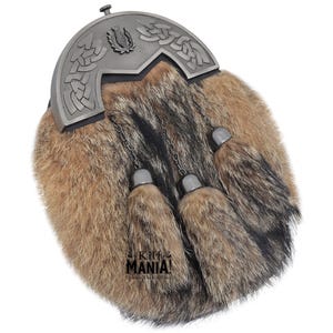 May include: A brown and black fur sporran with a silver metal cantle featuring a Celtic knot design and a thistle emblem. The sporran has three brown fur tassels.