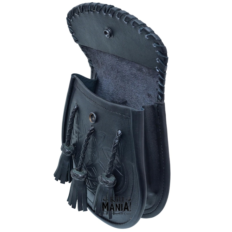 May include: Black leather kilt pouch with a Celtic knot design and a flap closure. The pouch has three tassels and a black lining.