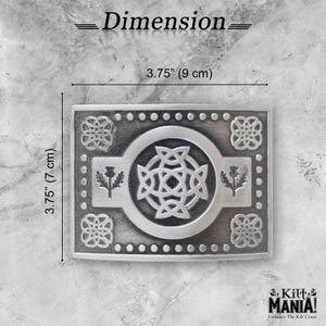 May include: A rectangular silver-colored kilt belt buckle with Celtic knot and thistle designs. The buckle measures 3.75 inches (9 cm) wide and 3.75 inches (7 cm) tall. The text "Dimension" is at the top, and the brand name "Kilt Mania!" is at the bottom.