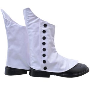 May include: White canvas gaiters with black buttons and a black rubber sole.