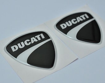 2 x Duat-sticker (58 x 55 mm) gewelfd 3D-sticker met logo