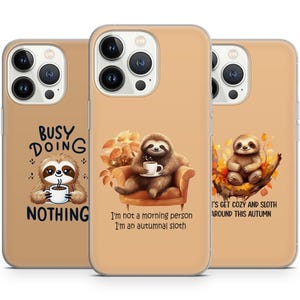 May include: Three phone cases with a sloth design. The first case says "Busy doing nothing". The second case says "I'm not a morning person, I'm an autumnal sloth". The third case says "Let's get cozy and sloth around this autumn".