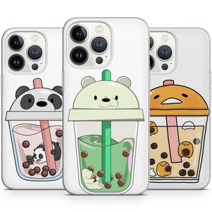 May include: Three phone cases with different designs. Each case features a cartoon character holding a boba tea. The first case has a panda, the second case has a polar bear, and the third case has a yellow chick.