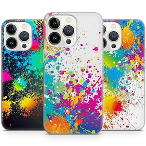May include: Three iPhone cases with a colorful paint splatter design. The cases are clear, black, and white.