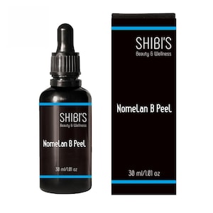 May include: A black bottle with a dropper and a matching black box. The bottle and box both feature the text "SHIBI'S Beauty & Wellness" and "Nomelan B Peel". The bottle contains 30 ml / 1.01 oz of product.