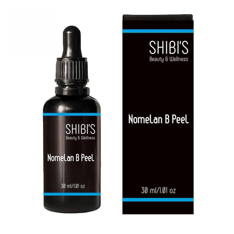 May include: A black bottle with a dropper and a matching black box. The bottle and box both feature the text "SHIBI'S Beauty & Wellness" and "Nomelan B Peel". The bottle contains 30 ml / 1.01 oz of product.