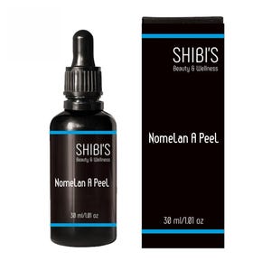 May include: A black bottle with a dropper and a matching black box. The bottle and box both feature the text "SHIBI'S Beauty & Wellness" and "Nomelan A Peel". The bottle contains 30 ml / 1.01 oz of product.