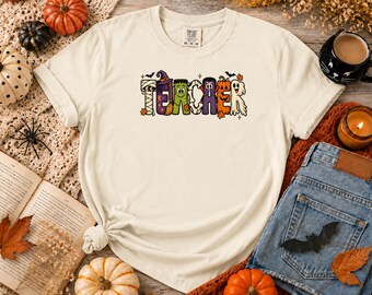Comfort Colors® halloween-teacher-shirt-spooky-character-letters-t-shirt-cute-fall-classroom-teacher-gift