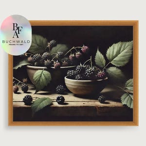 May include: A still life photograph of blackberries in two bowls on a wooden table. The blackberries are arranged in a cluster and are surrounded by green leaves. The background is dark and the lighting is soft.