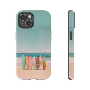 A white background with an iPhone face front on the left side and a side view of the iPhone on the right side. The image on the iPhone is of surfboards standing on a beach by the ocean