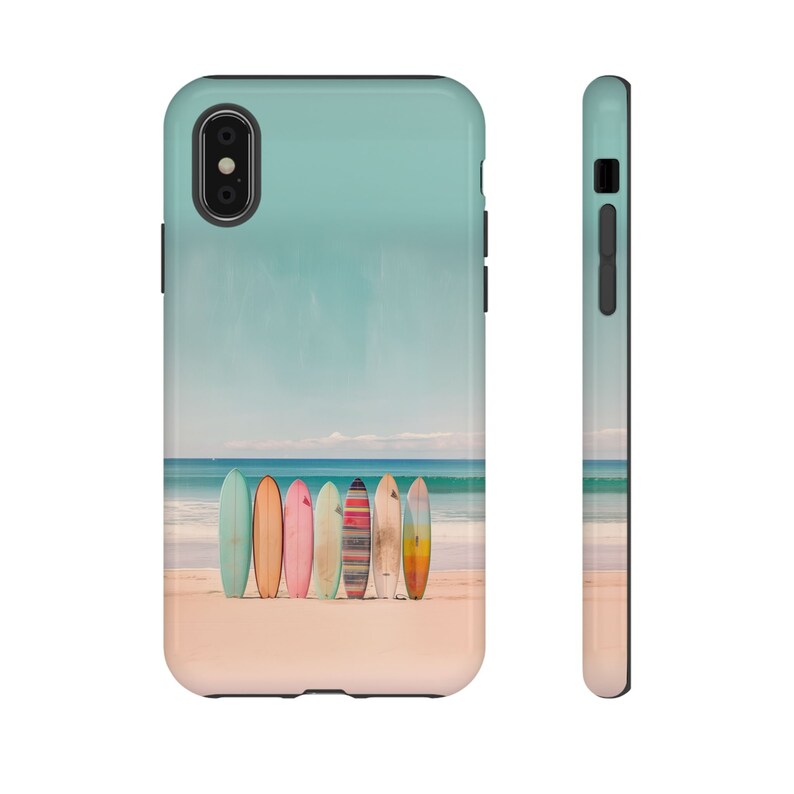 A white background with an iPhone face front on the left side and a side view of the iPhone on the right side. The image on the iPhone is of surfboards standing on a beach by the ocean