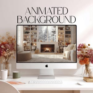 May include: A silver desktop computer monitor displaying a cozy living room scene with a fireplace, bookshelves, and a snowy window view. The text ANIMATED BACKGROUND is printed above the screen. Two vases of dried flowers sit on the desk.