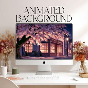 May include: A silver desktop computer monitor displaying an animated digital illustration of a coffee shop at night with a large cherry blossom tree. The text ANIMATED BACKGROUND is centered above the screen. The monitor sits on a white desk.