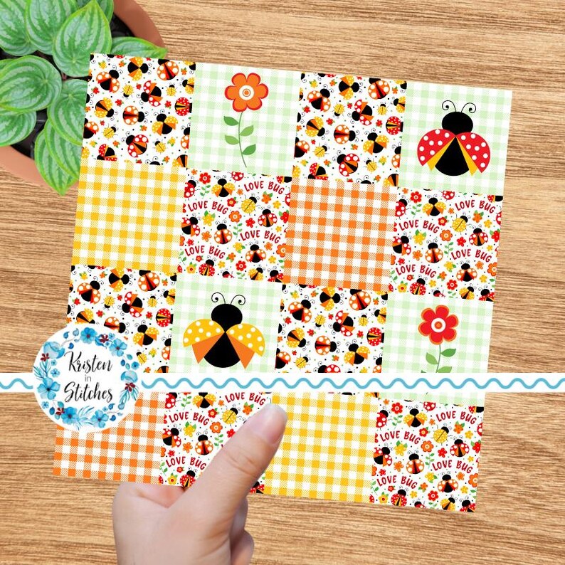 May include: A colorful patchwork design featuring ladybugs, flowers, and gingham patterns in orange, yellow, and green. The design includes the text "LOVE BUG" and is held by a hand. The design is from "Kristen in Stitches".