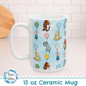 May include: White 15 oz ceramic mug featuring a repeating pattern of cartoon characters holding balloons against a light blue polka-dot background. Characters include a yellow bear, a pink pig, a gray donkey, and a tiger. The mug has a large white handle.