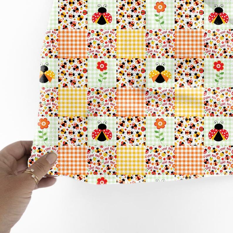 May include: A patchwork fabric featuring ladybugs, flowers, and the text "LOVE BUG" on a light green and white background. The design incorporates orange and yellow gingham squares.