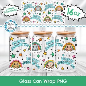 May include: Three clear 16 oz glass tumblers with bamboo lids and glass straws, featuring a repeating pattern of cats sitting on rainbows, colorful stars, and the text Silently Judging You in light blue, set against a white background.
