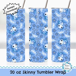 May include: A 20 oz skinny tumbler wrap featuring a repeating pattern of blue axolotls, flowers, and hearts on a light blue background. The design includes the text "Instant Download" and "Kristen Stitches". The tumbler has a silver straw.