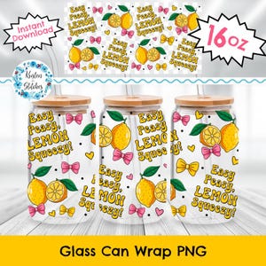 May include: Three clear glass can wraps with bamboo lids, straws, and a lemon design. Each wrap features the text "Easy Peasy, LEMON Squeezy!" along with illustrations of lemons, bows, and hearts. The wraps are 16 oz.