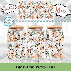 May include: Three glass can wraps with a Tigger design, flowers, and leaves. Each glass has a bamboo lid and a straw. The design includes the text "Glass Can Wrap PNG" and "16 oz".