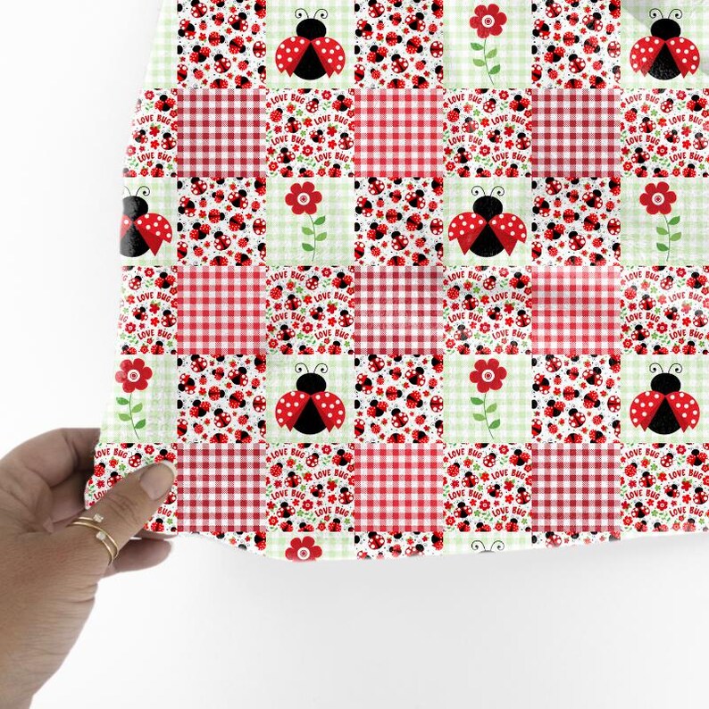 May include: A patchwork design featuring red gingham squares, ladybugs, and red flowers on a light green background. The ladybugs have red wings with black spots. The words "LOVE BUG" are printed on some squares.
