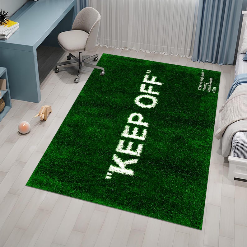 May include: Green area rug with the text "KEEP OFF" in white lettering. The rug has a short, plush pile.