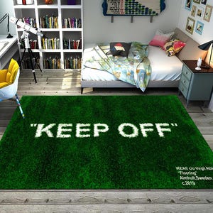May include: A green shag rug with the text "KEEP OFF" in white lettering. The rug has a white label with the text "IKEA® c/o Virgil Abloh™ "Flooring" Almhult, Sweden c.2019"