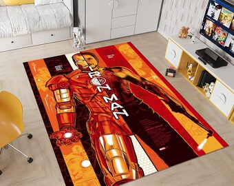 May include: A red and orange area rug with a graphic of Iron Man. The rug features the text "Iron Man" and "Heroes are made, not born".