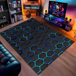 May include: A black and blue geometric rug with a honeycomb pattern. The rug has a modern design and would be a great addition to any home.