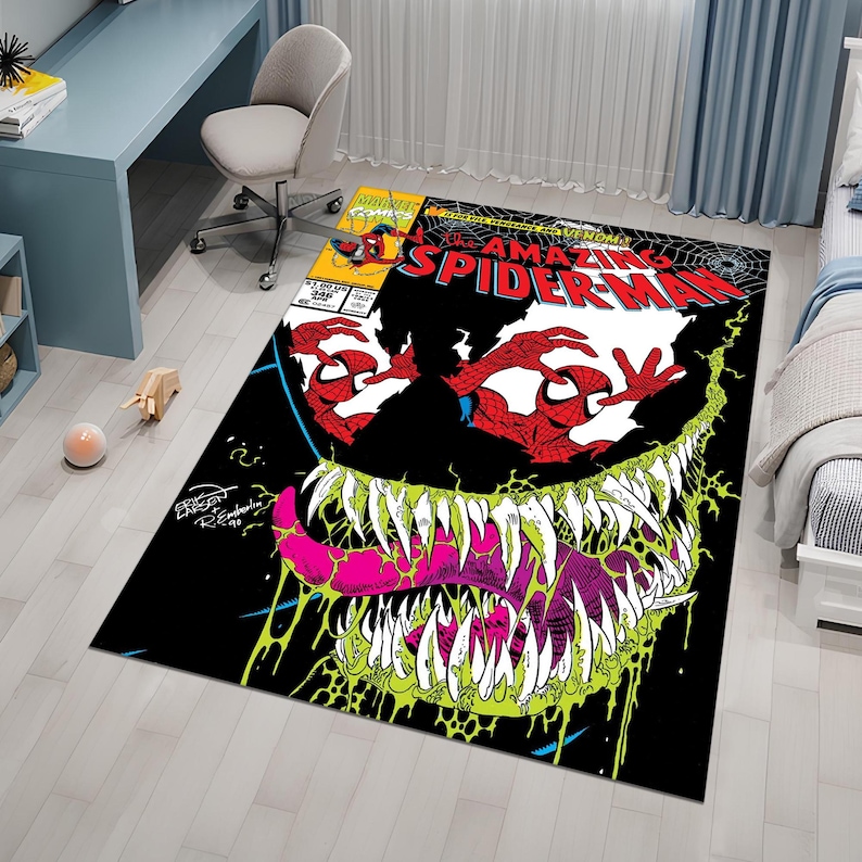 May include: A black and green rug with a comic book design featuring Venom and Spider-Man. The rug has the text "The Amazing Spider-Man" and "Venom" printed on it.