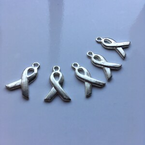 Destash Silvery cancer awareness ribbon charms 100% donation to cancer research image 1