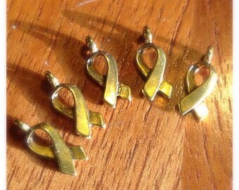 Destash TEN (10) golden awareness ribbon charms- 100% donation to cancer research