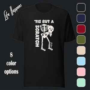 May include: Black t-shirt with a white skeleton graphic and the text "'Tis But A Scratch".