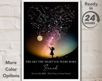 May include: A framed print featuring a heart-shaped constellation design with a silhouette of a person reaching towards it. The print includes the text "THE SKY THE NIGHT YOU WERE BORN" and "Sarah", with the date and location below. The words "More Color Options" and "Framed and Unframed options" are also visible.