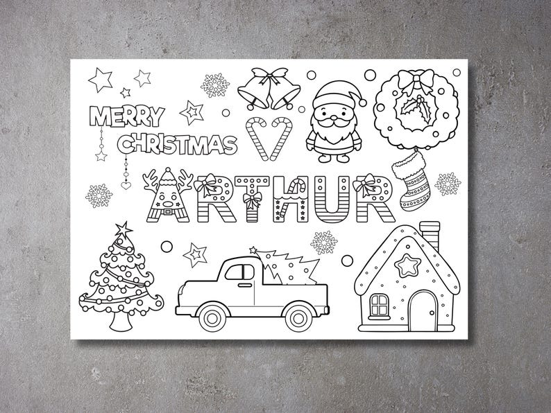 May include: A black and white colouring page featuring a Christmas scene with a truck, a gingerbread house, a Christmas tree, a wreath, a stocking, a Father Christmas, and the name "Arthur". The text "Merry Christmas" is also included.