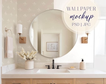 May include: A bathroom interior with a large round mirror, a white countertop, and light wood cabinetry. The image includes a sink, faucet, soap dispenser, and a vase of white flowers. The text "WALLPAPER mockup PSD | JPG" is visible.