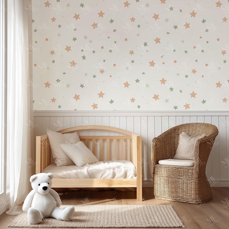 May include: A nursery scene with a light wood crib, a wicker chair, and a large white teddy bear. The wall is decorated with a star pattern in muted colors. A neutral rug and white curtains complete the room.
