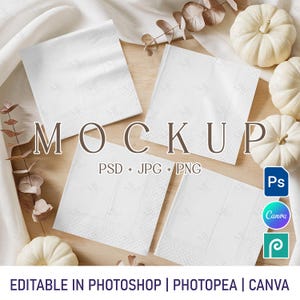 May include: A mockup featuring four white square napkins with a textured pattern, arranged on a wooden surface. The word "MOCKUP" is displayed in large letters. White pumpkins and foliage are also present. The image includes text: "PSD + JPG + PNG" and "EDITABLE IN PHOTOSHOP | PHOTOPEA | CANVA".