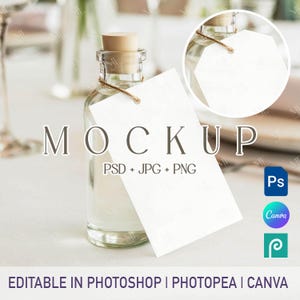May include: A clear glass bottle with a cork stopper and a blank white tag attached with twine. The word "MOCKUP" is displayed above the bottle. Text below the bottle reads "EDITABLE IN PHOTOSHOP | PHOTOPEA | CANVA".