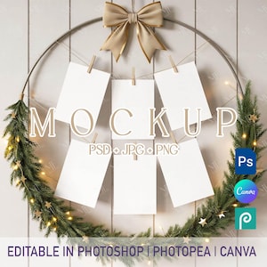 May include: A circular wreath with a gold bow and blank white cards clipped to it. The word "MOCKUP" is displayed, along with "PSD + JPG + PNG". The bottom of the image reads "EDITABLE IN PHOTOSHOP | PHOTOPEA | CANVA".