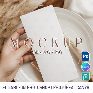May include: A white rectangular mockup card held in a hand, with the word "MOCKUP" in brown letters. The text "PSD + JPG + PNG" is below the word. The image also includes icons for Photoshop, Canva, and Photopea, and the text "EDITABLE IN PHOTOSHOP | PHOTOPEA | CANVA".
