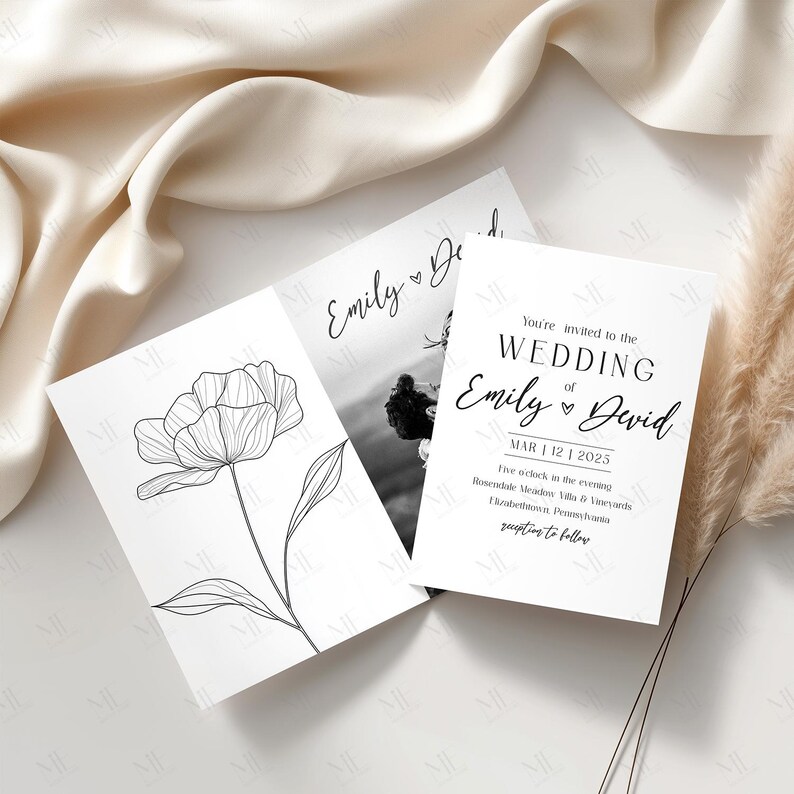 May include: Three white wedding invitation cards. One card features a black and white floral line drawing. Another card has a black and white photo. The third card has the text "You're invited to the WEDDING of Emily & David".