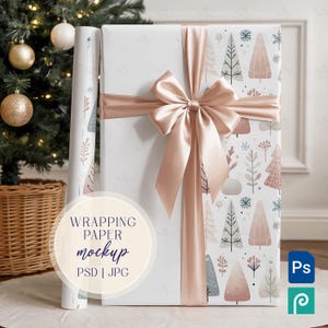 May include: A wrapped gift with a blush pink satin ribbon and bow. The wrapping paper features a pattern of stylized trees in muted tones of pink, gray, and white. A roll of matching wrapping paper is visible to the left. Text on the image reads "Wrapping Paper Mockup".