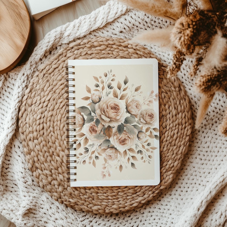 May include: A spiral bound journal with a beige cover featuring a watercolor illustration of a bouquet of blush pink roses with green leaves.