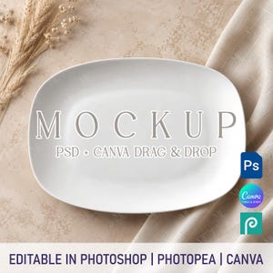 May include: A white oval ceramic serving platter featuring the text MOCKUP PSD + CANVA DRAG & DROP. The platter is displayed with dried wheat stalks and beige fabric. The bottom text reads EDITABLE IN PHOTOSHOP | PHOTOPEA | CANVA.