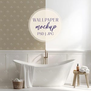 May include: A white bathtub with a white towel draped over the side, a wicker basket with towels, and a wooden stool with a bottle of soap and towels. The wall behind the bathtub is a light brown with a white pattern. The text "WALLPAPER MOCKUP PSD | JPG" is in a circle on the wall.