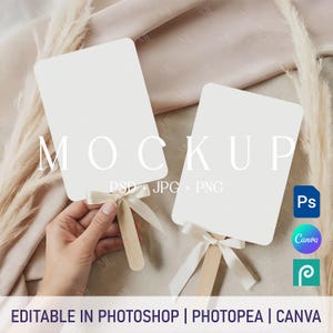 May include: Two blank white rectangular mockups with wooden handles and cream-colored ribbons. The word "MOCKUP" is printed on the mockups. The text "EDITABLE IN PHOTOSHOP | PHOTOPEA | CANVA" is printed at the bottom of the image.